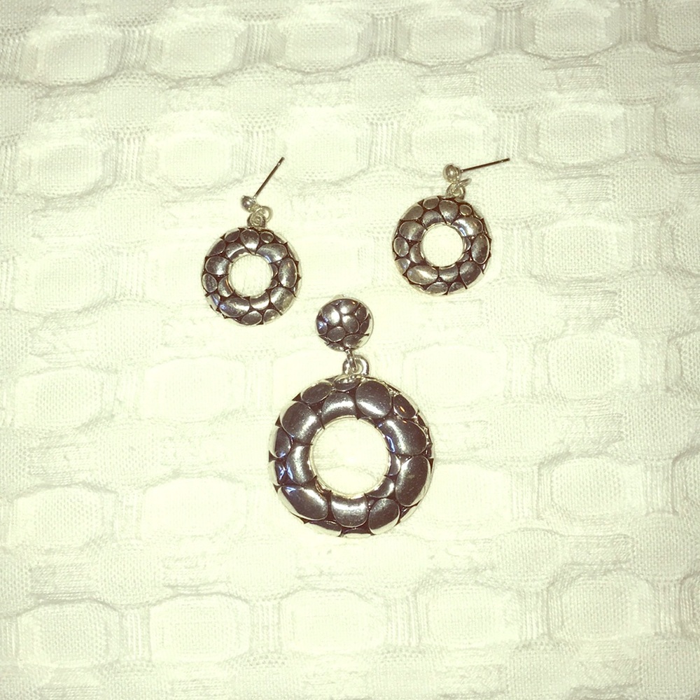 This is a set of earrings with a medallion.